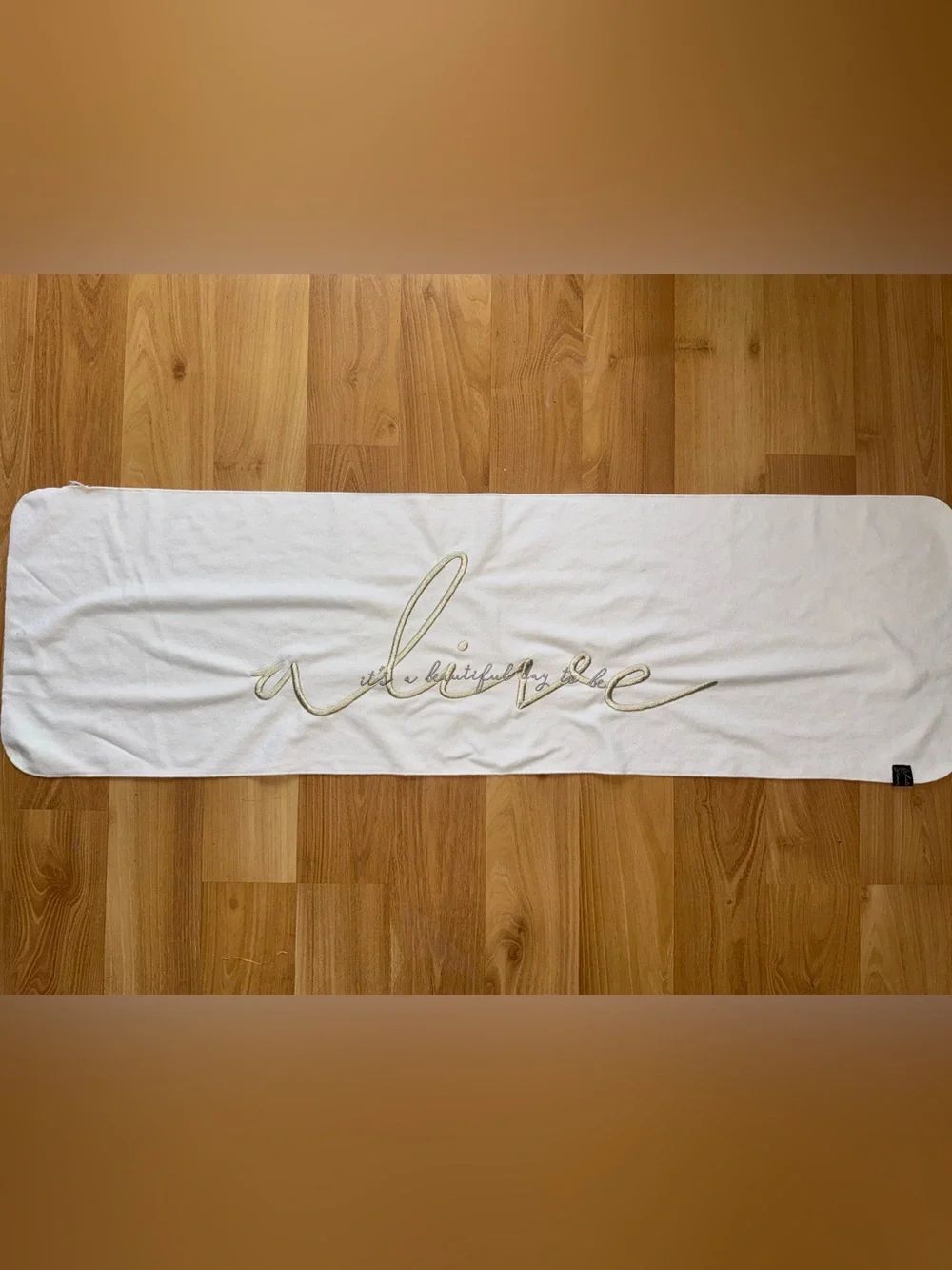 Gymshark Embroidered Sweat Towel with Gold Script Writing